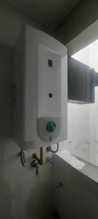 Calefón instalado en la pared